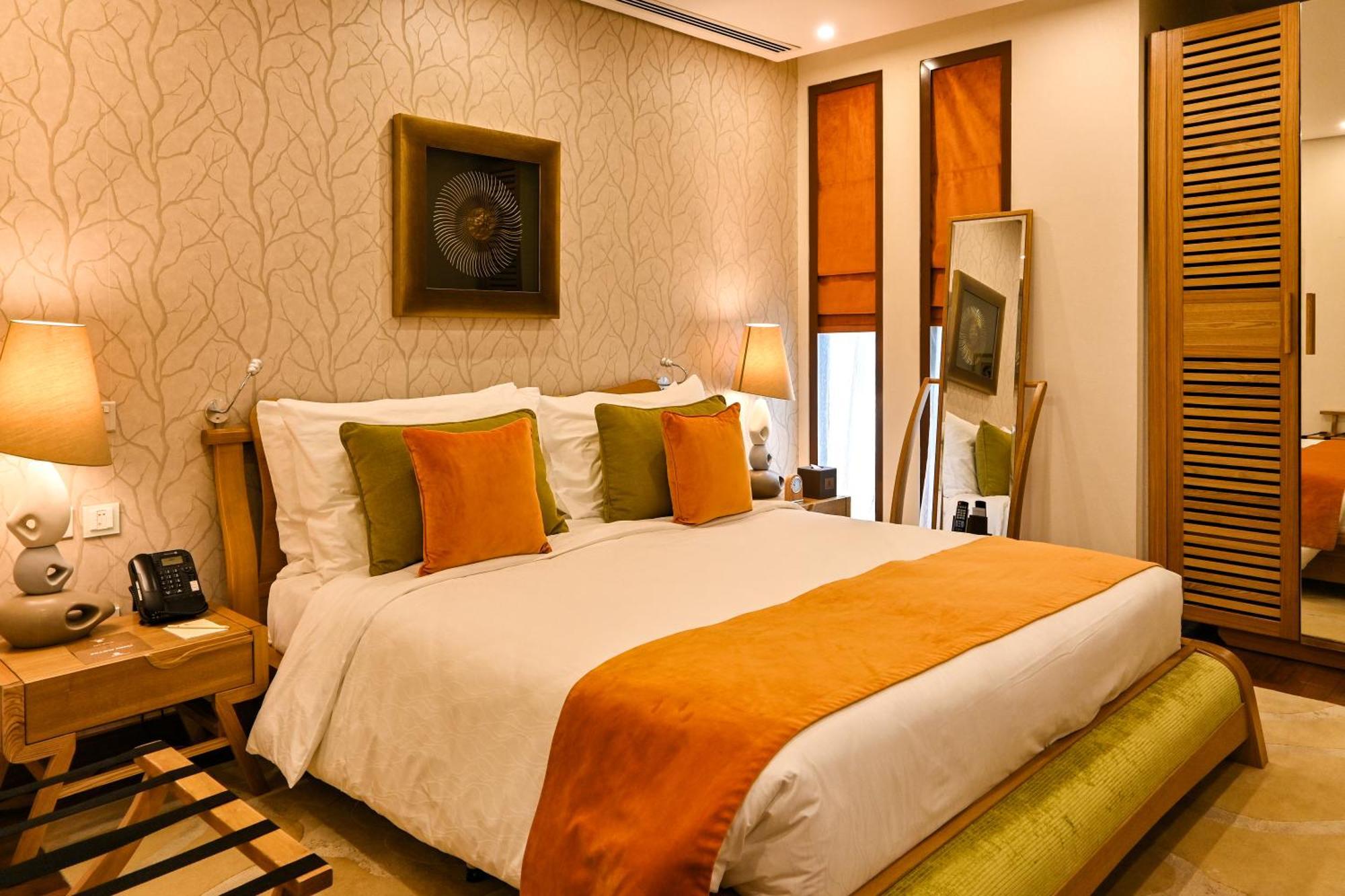 מנאמה Palavra Resort מראה חיצוני תמונה A bedroom at the Taj Bengal