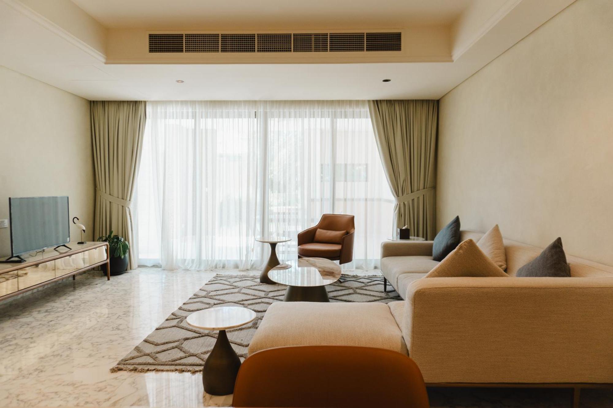 מנאמה Palavra Resort מראה חיצוני תמונה A living room in a condominium