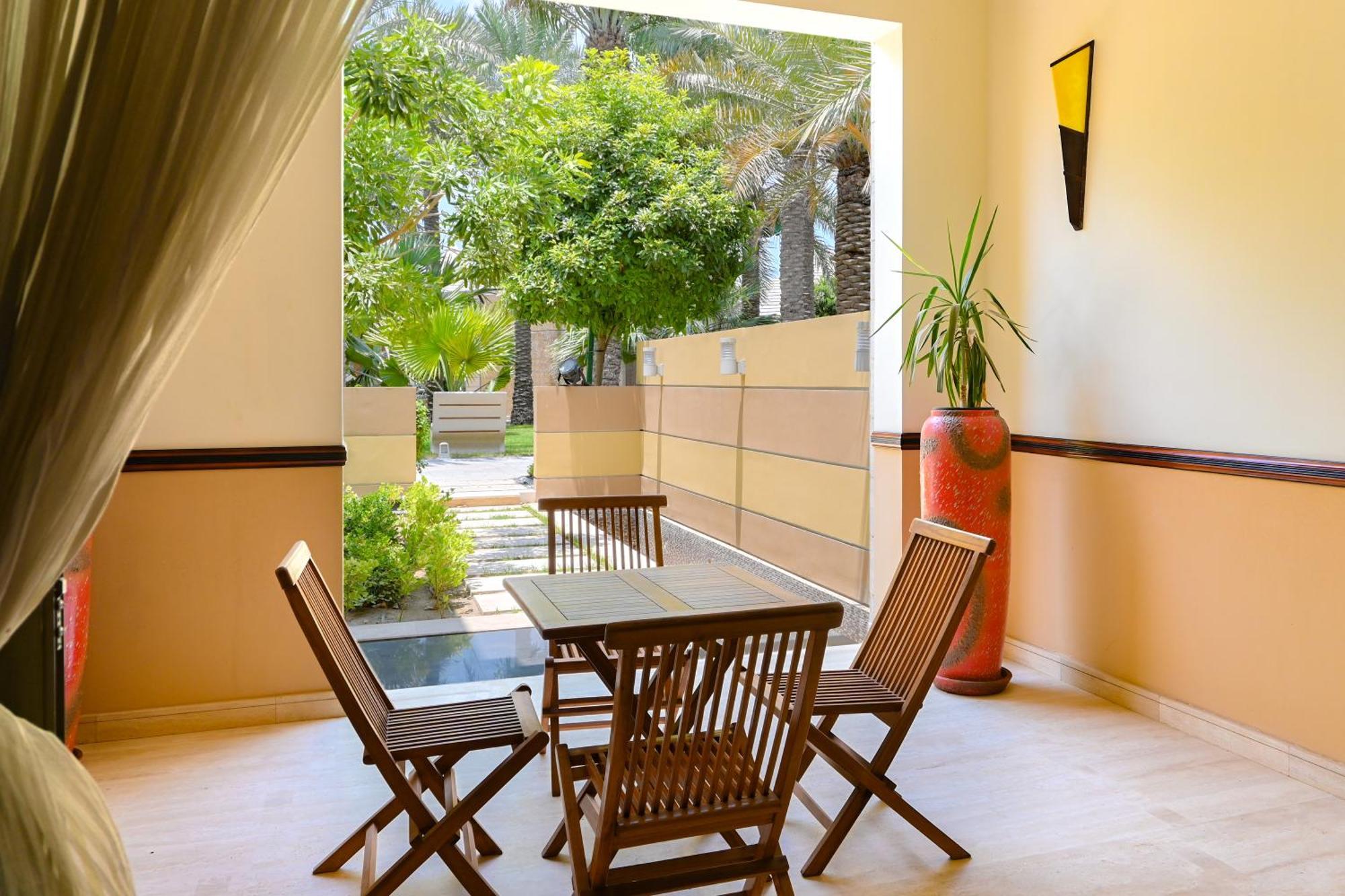מנאמה Palavra Resort מראה חיצוני תמונה A typical room at the resort