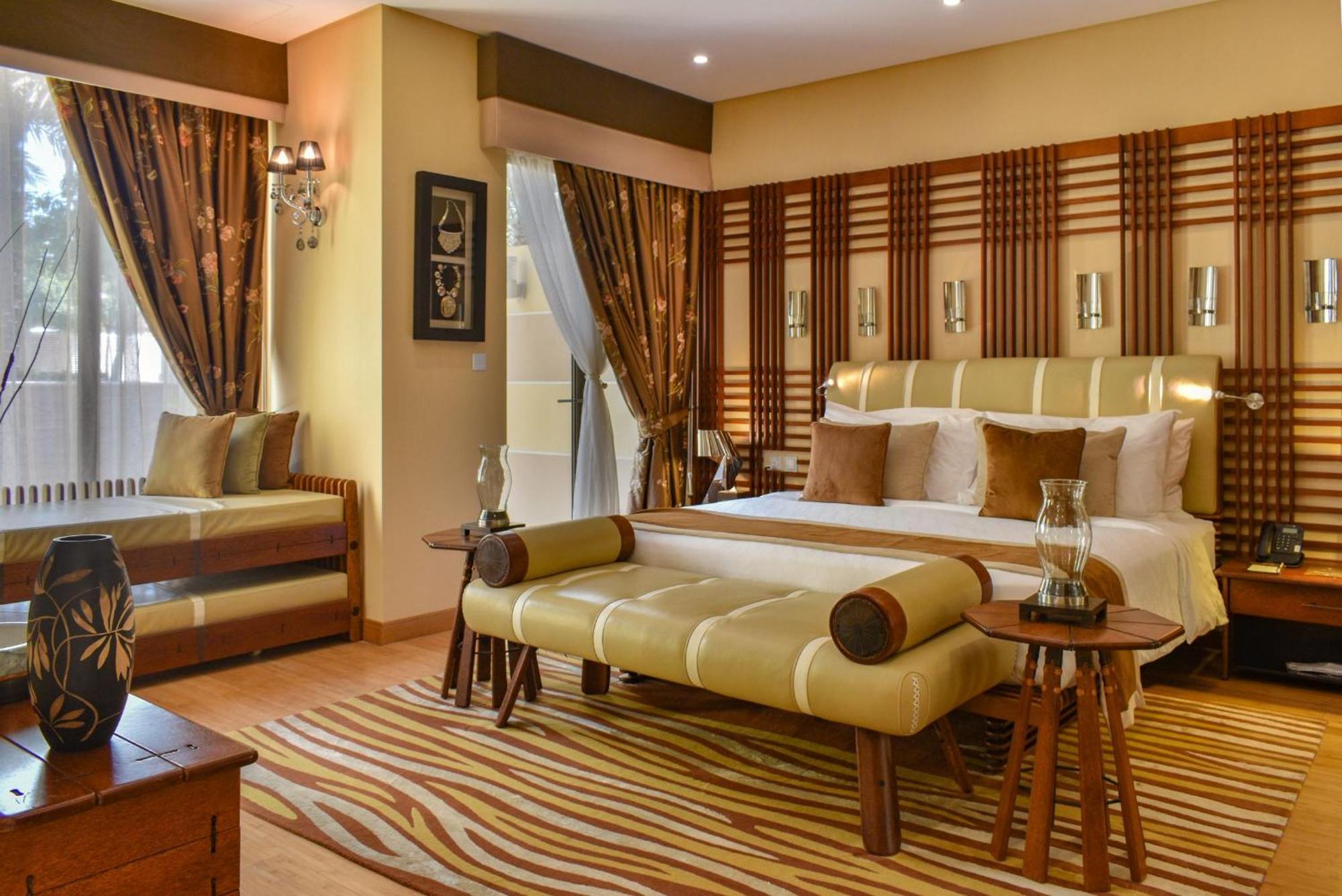 מנאמה Palavra Resort מראה חיצוני תמונה A bedroom at the Taj Bengal